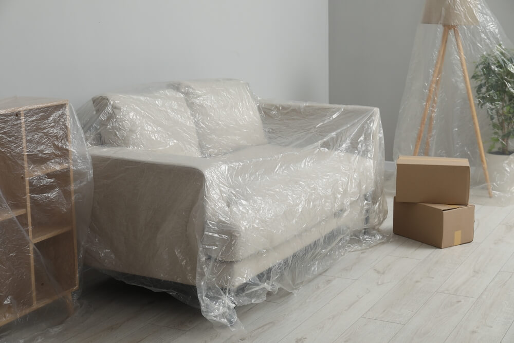 Wrapping furniture with protective material before moving Wrapping furniture with protective material before moving