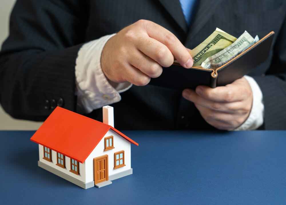 Man budgeting money for housing expenses in Christchurch Man budgeting money for housing expenses in Christchurch