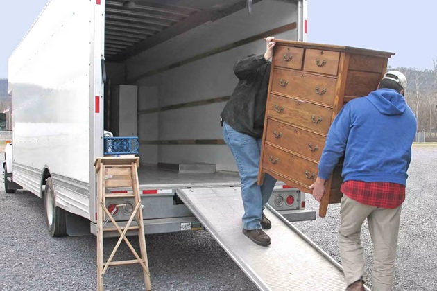 Moving Champs Lifting Heavy Furniture Carefully